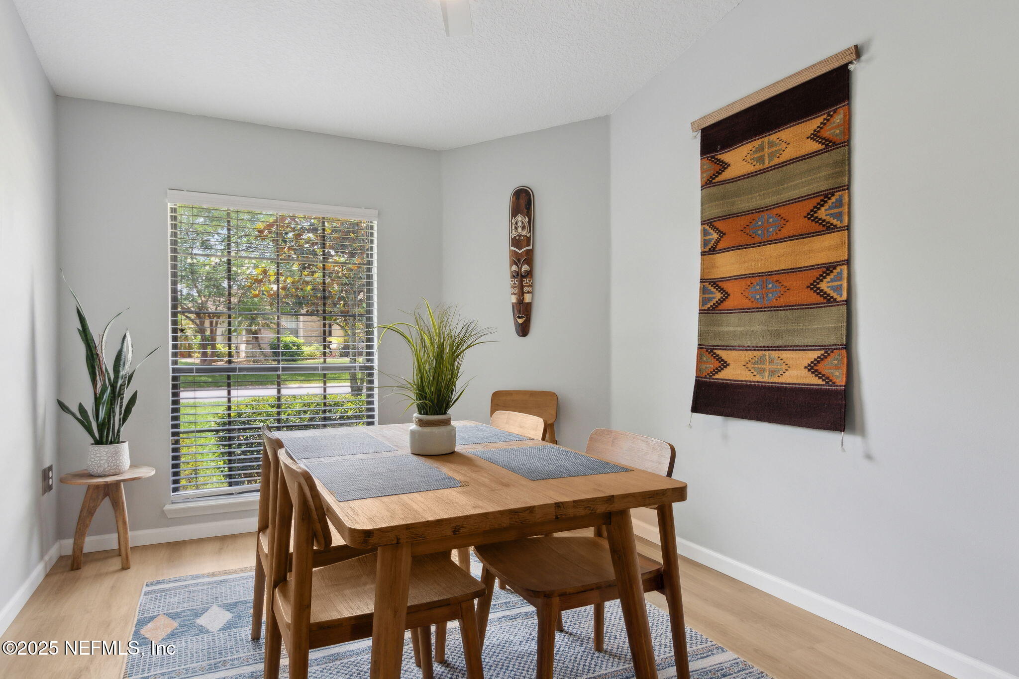 944 North Lilac Loop St. Johns, FL 32259 - Photo 17 of 55 a view of a dining room with furniture window and wooden floor