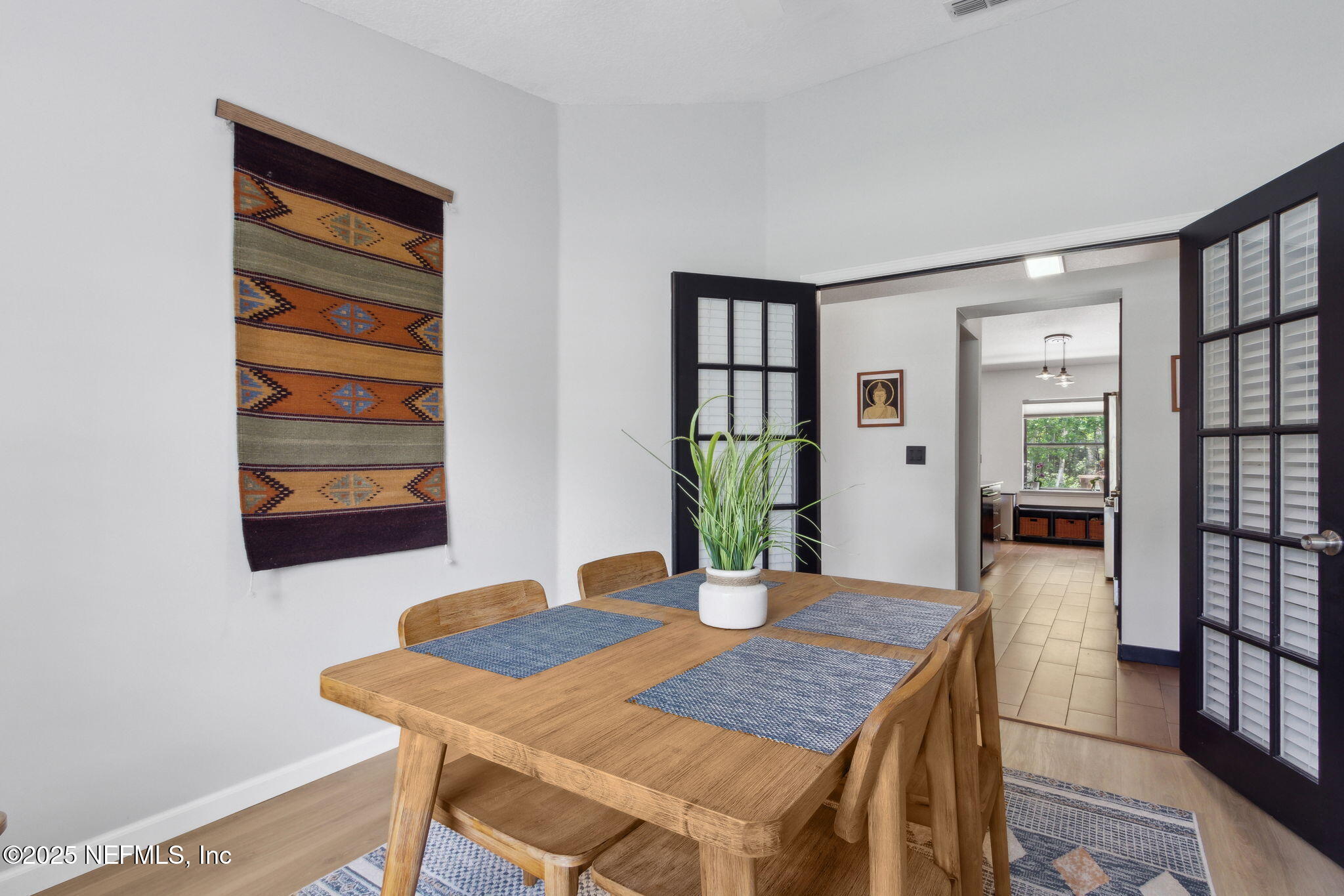 944 North Lilac Loop St. Johns, FL 32259 - Photo 18 of 55 a view of a dining room with furniture and a potted plant