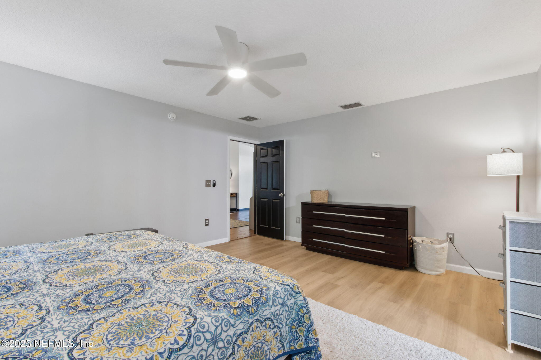944 North Lilac Loop St. Johns, FL 32259 - Photo 21 of 55 a bedroom with a bed and a chandelier
