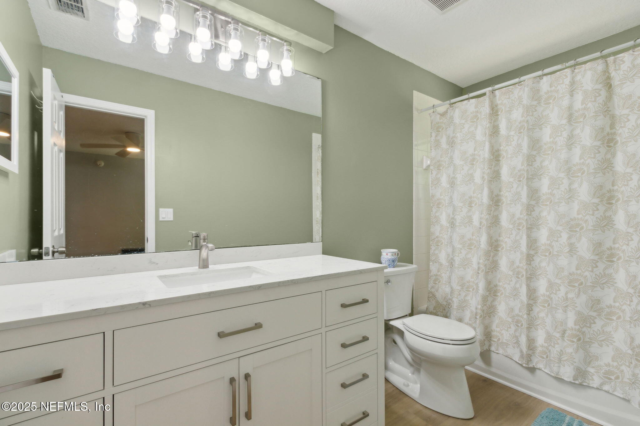 944 North Lilac Loop St. Johns, FL 32259 - Photo 23 of 55 a bathroom with a toilet a sink and a mirror