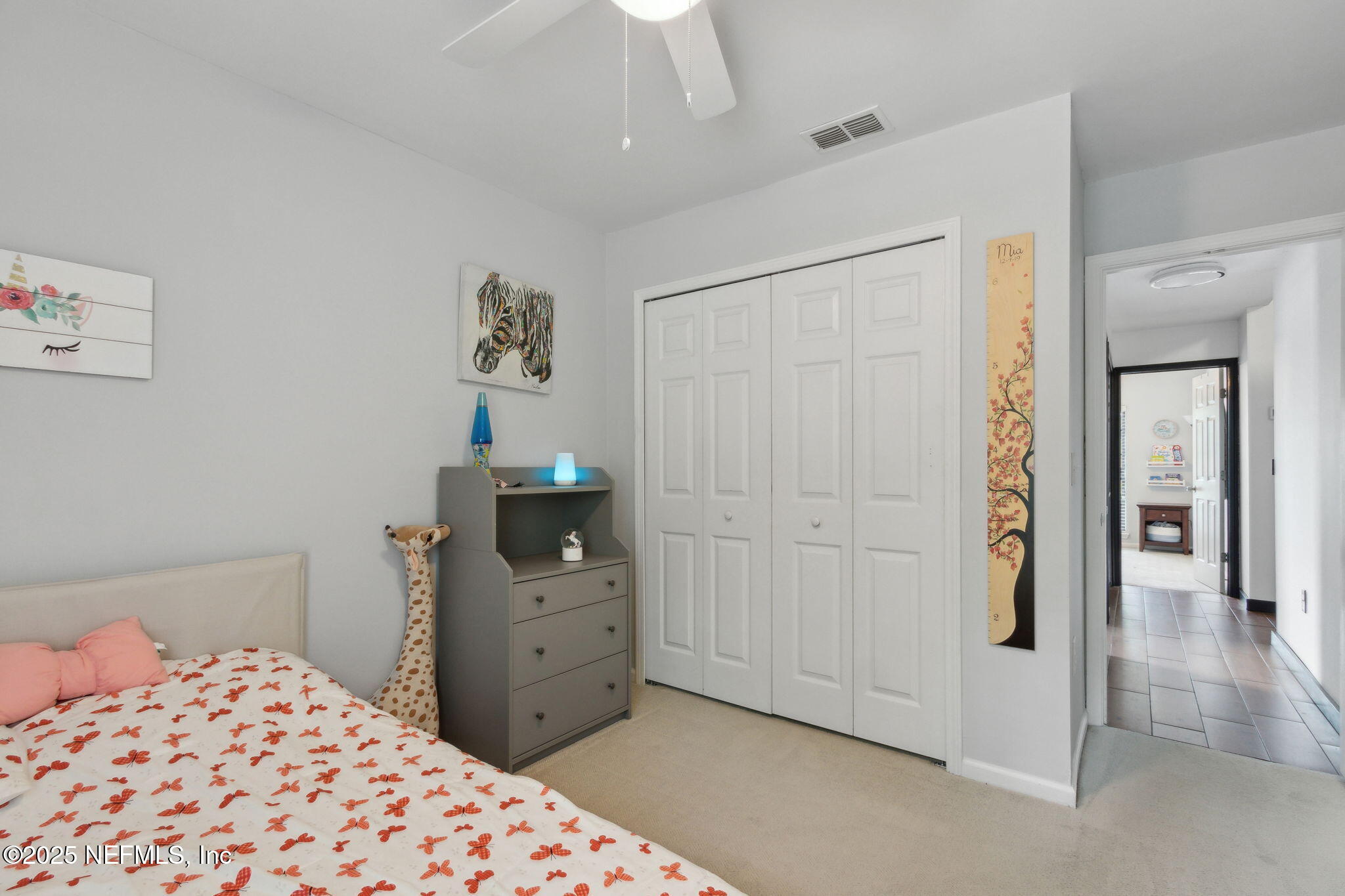 944 North Lilac Loop St. Johns, FL 32259 - Photo 28 of 55 a bedroom with a dresser and a chandelier