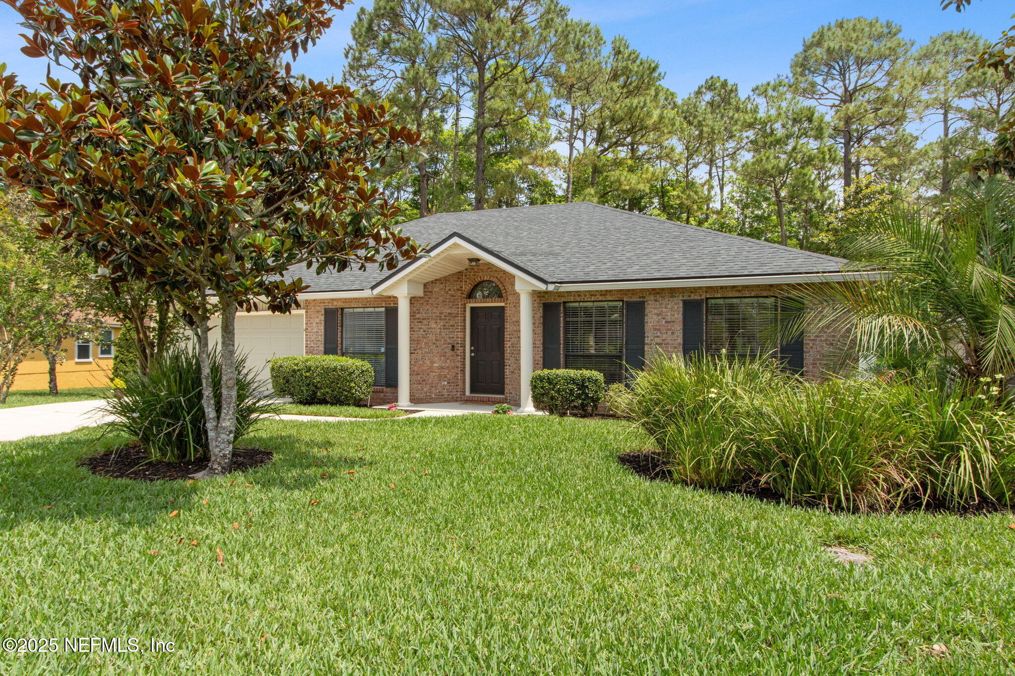 944 North Lilac Loop St. Johns, FL 32259 - Photo 3 of 55 a front view of a house with a yard