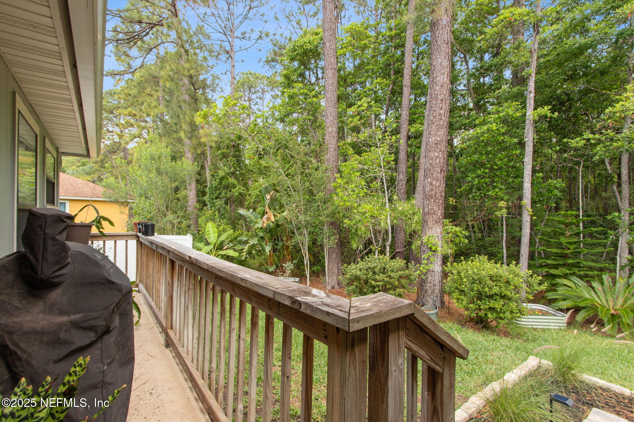 944 North Lilac Loop St. Johns, FL 32259 - Photo 34 of 55 a balcony with trees in front of it