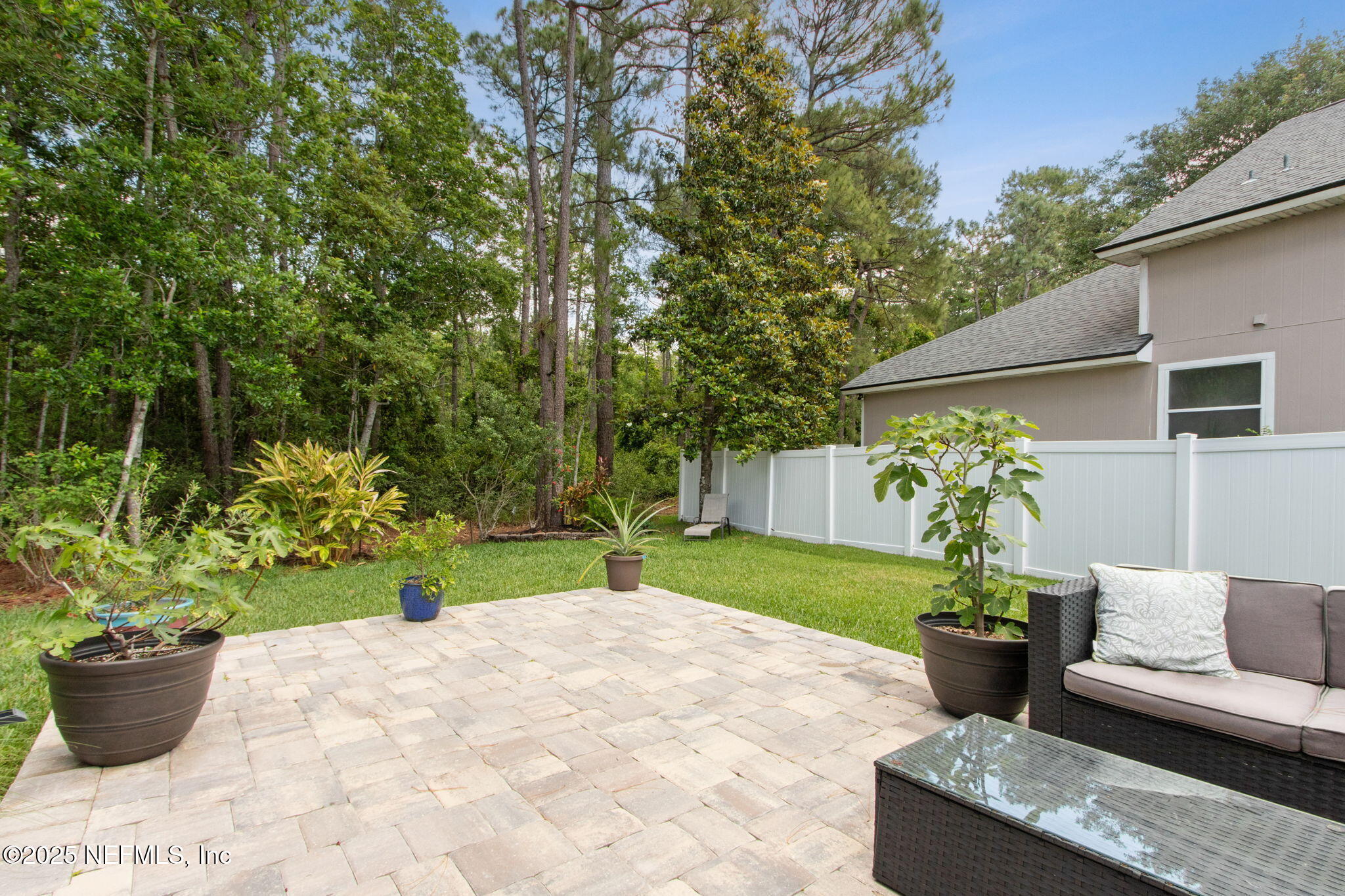 944 North Lilac Loop St. Johns, FL 32259 - Photo 38 of 55 a view of a backyard with garden and plants