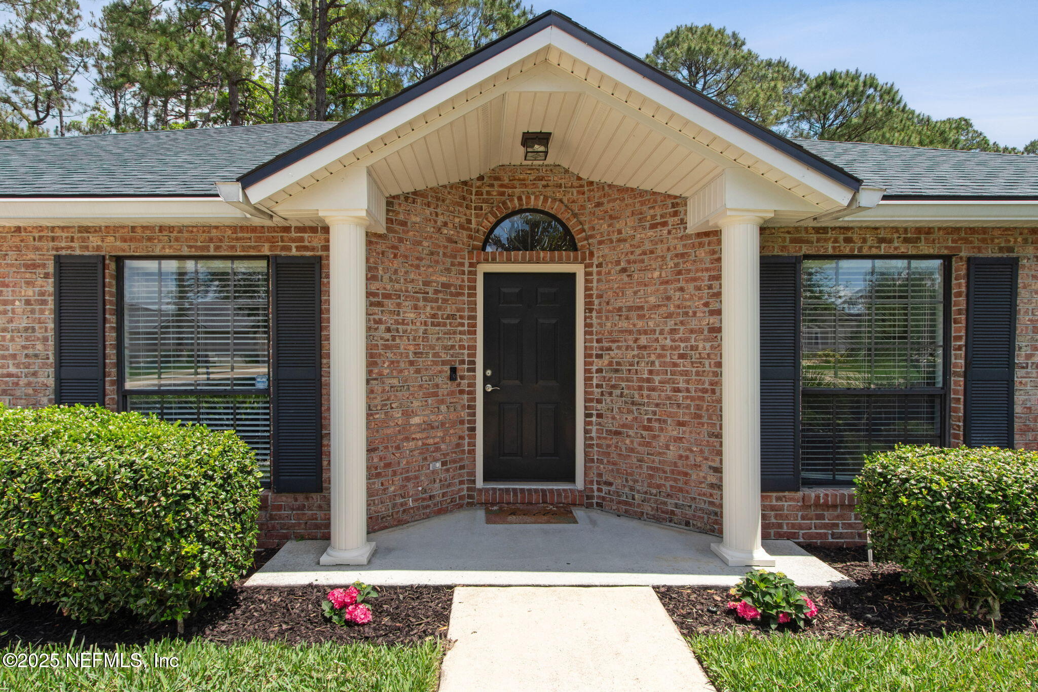 944 North Lilac Loop St. Johns, FL 32259 - Photo 4 of 55 a front view of a house with a yard