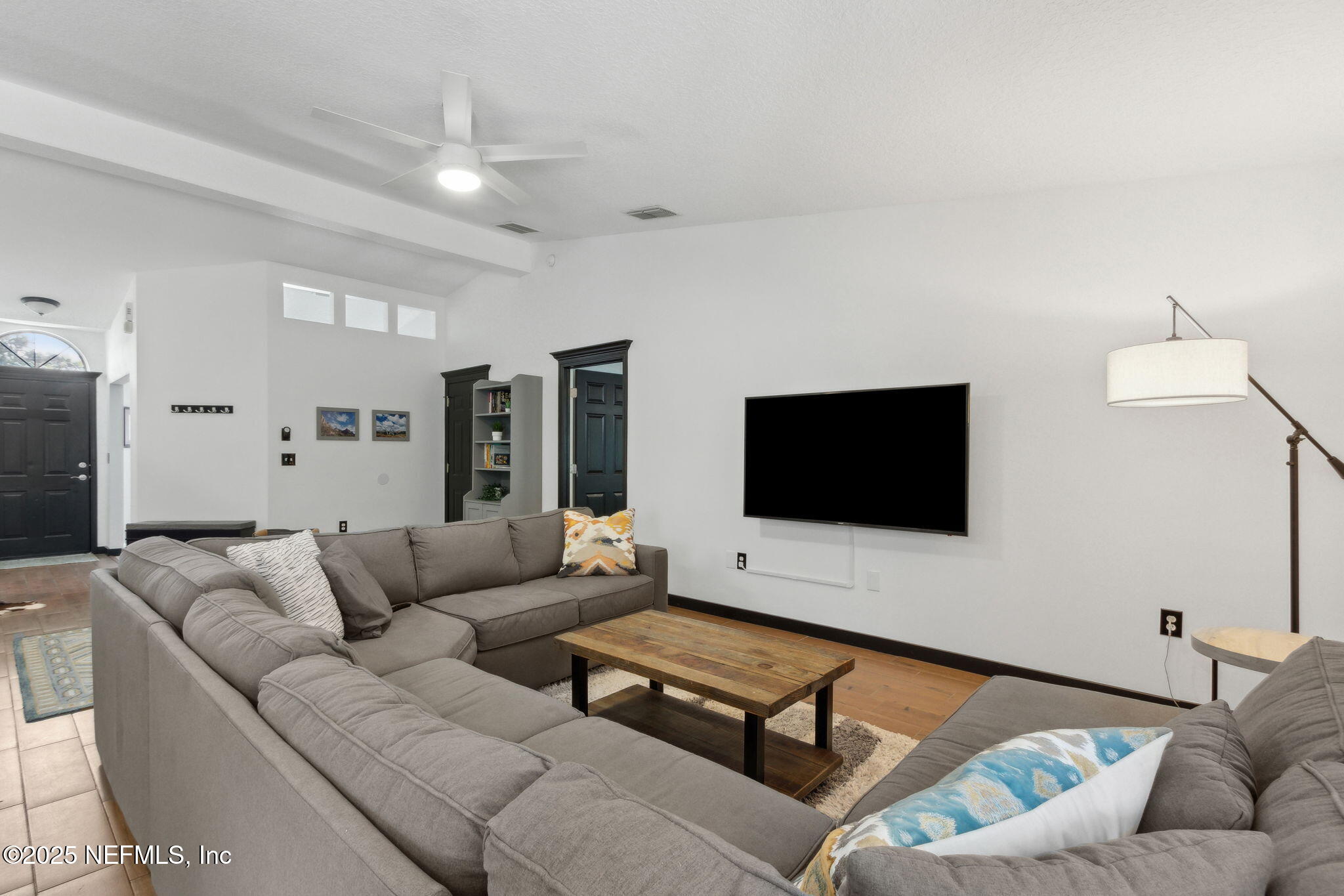 944 North Lilac Loop St. Johns, FL 32259 - Photo 7 of 55 a living room with furniture and a flat screen tv