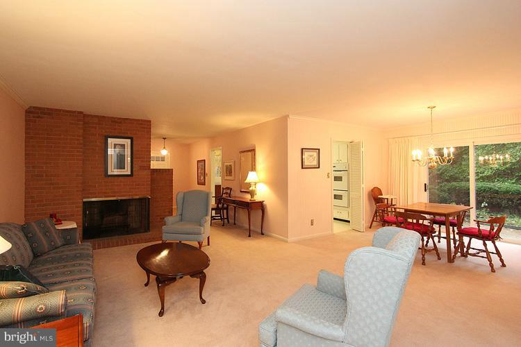 6606 Greyswood Road Bethesda, MD 20817 - Photo 14 of 26 Living Room w/fireplace & adjacent Dining Area