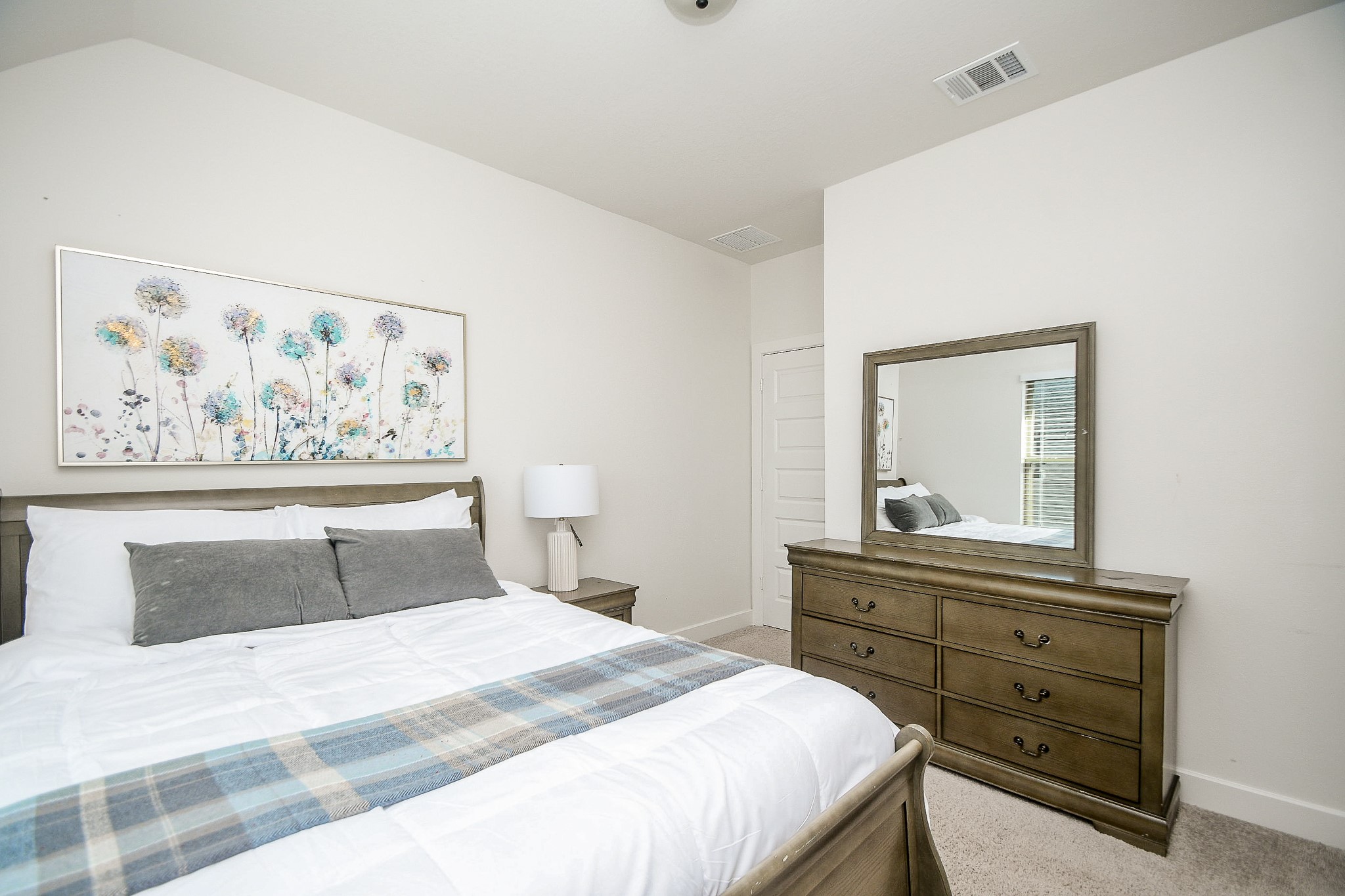 31407 Splitting Willow Lane Fulshear, TX 77441 - Photo 13 of 19 a bedroom with a bed and painting on the wall
