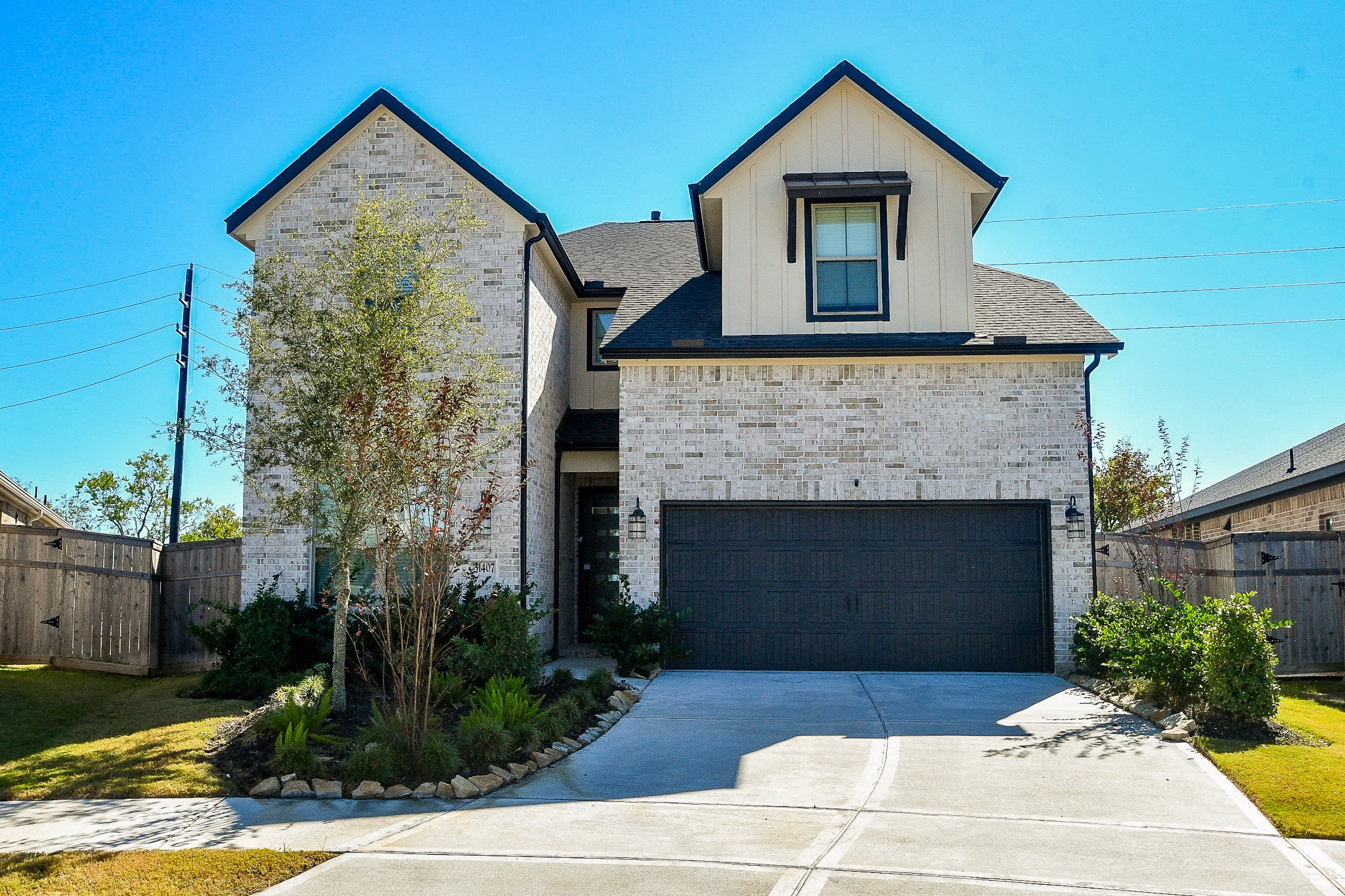 31407 Splitting Willow Lane Fulshear, TX 77441 - Photo 2 of 19 a front view of a house with yard
