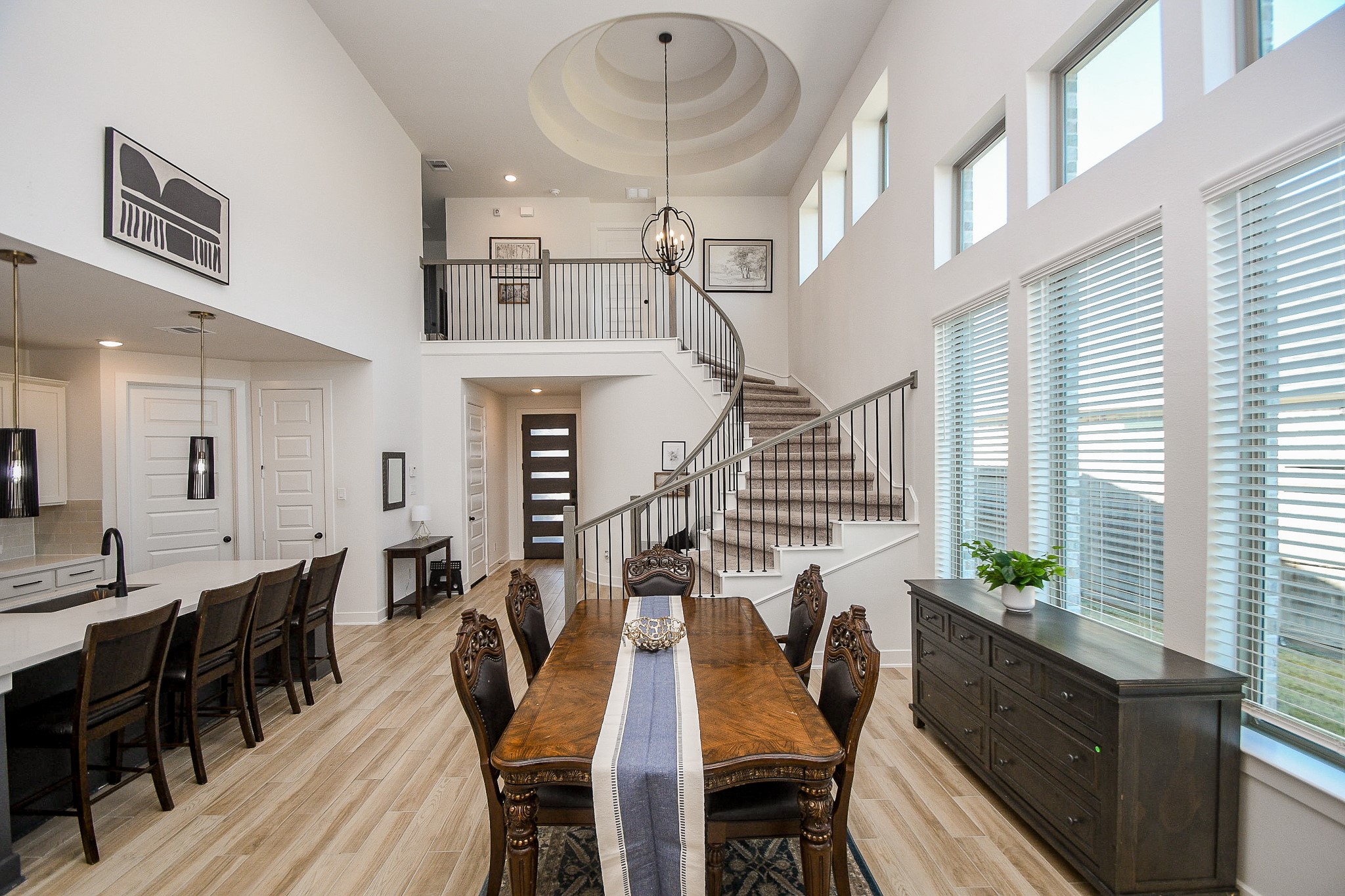 31407 Splitting Willow Lane Fulshear, TX 77441 - Photo 6 of 19 a view of a dining room with furniture and wooden floor