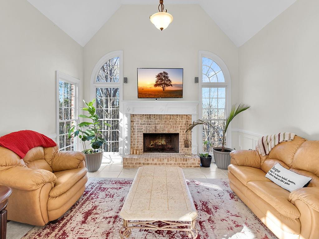 129 Preserve Parkway Ball Ground, GA 30107 - Photo 13 of 76 a living room with furniture and a fireplace