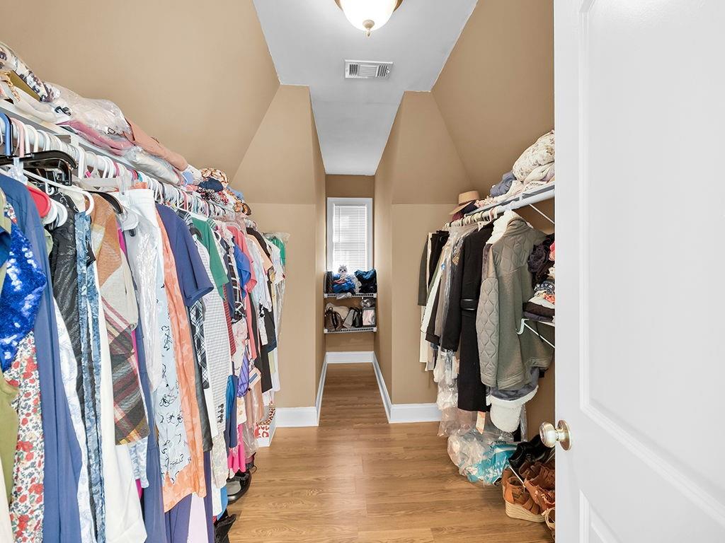 129 Preserve Parkway Ball Ground, GA 30107 - Photo 37 of 76 a view of walk in closet with clothes and shoes