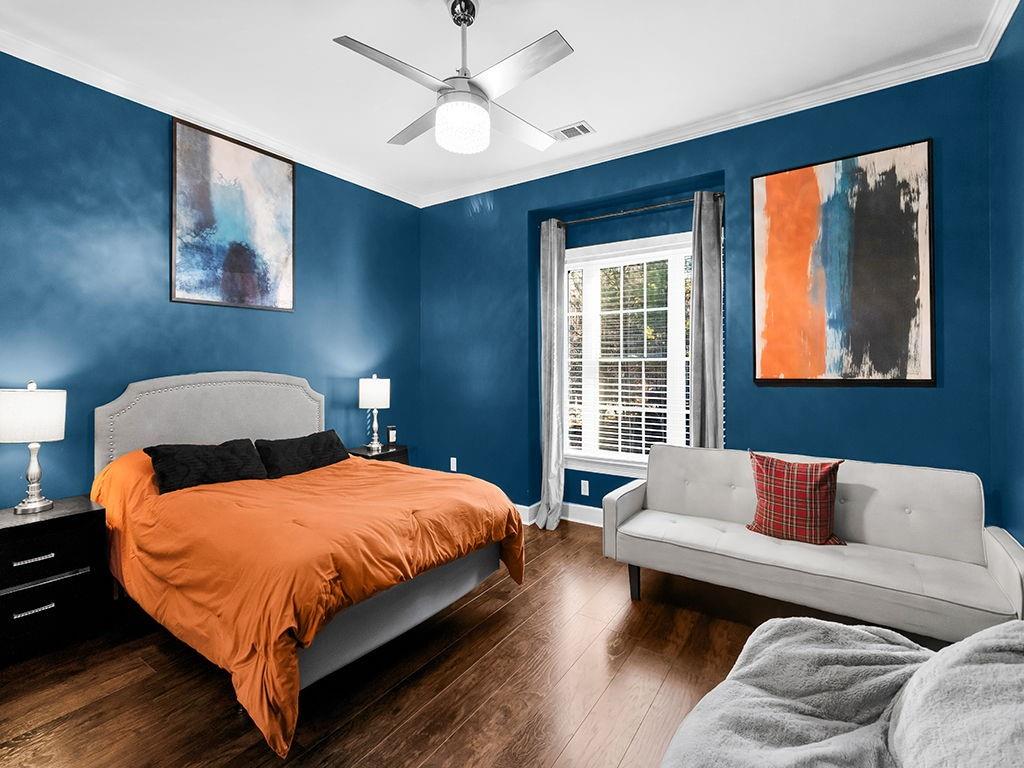 129 Preserve Parkway Ball Ground, GA 30107 - Photo 38 of 76 a bedroom with a bed couch and window