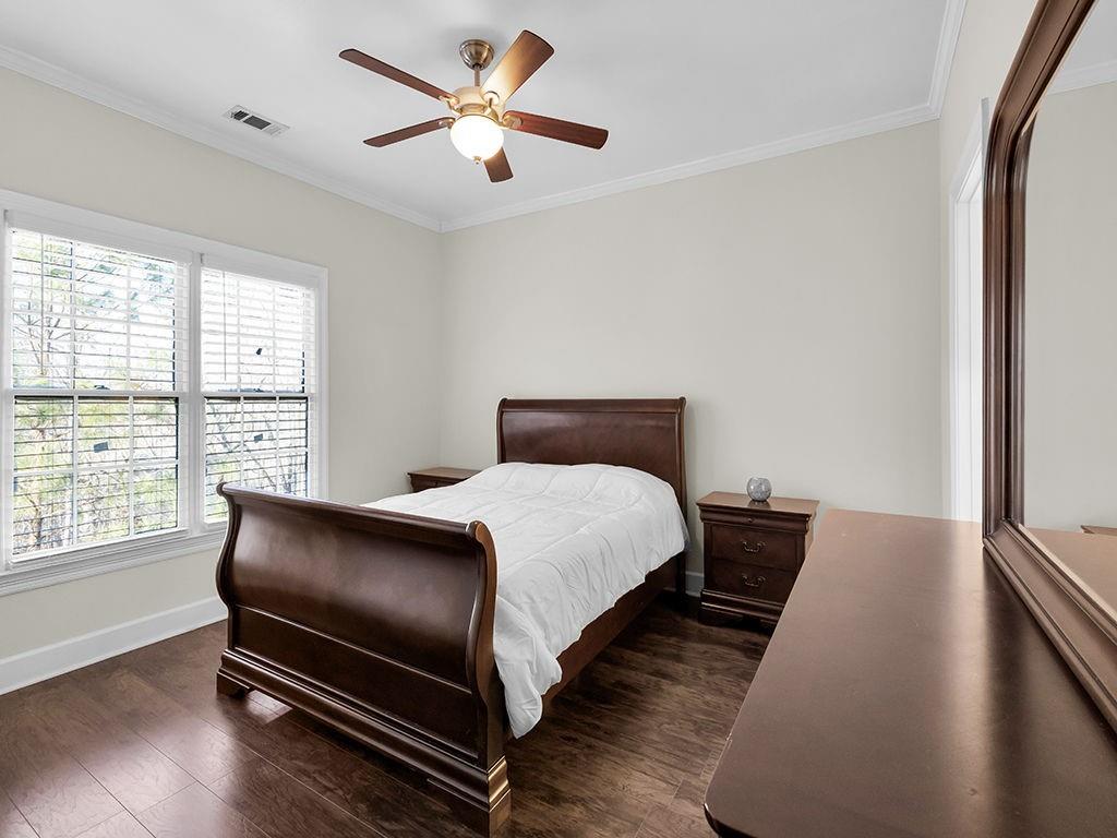 129 Preserve Parkway Ball Ground, GA 30107 - Photo 40 of 76 a bedroom with a bed and a window