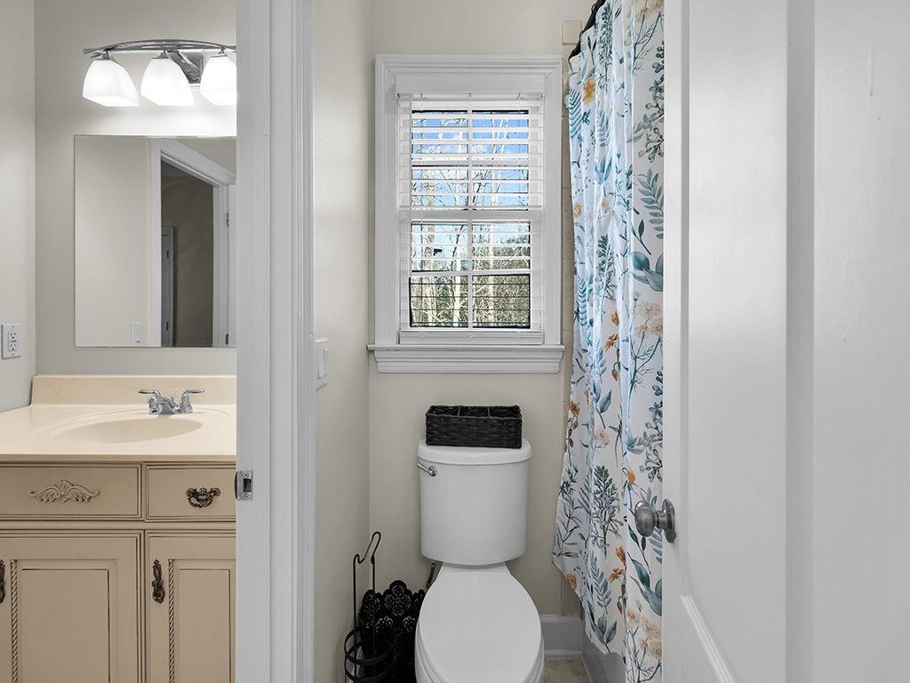 129 Preserve Parkway Ball Ground, GA 30107 - Photo 42 of 76 a bathroom with a toilet sink and mirror