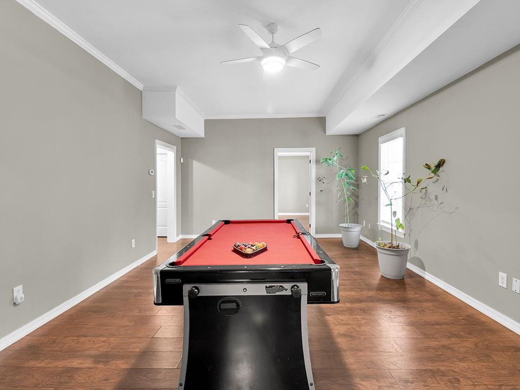 129 Preserve Parkway Ball Ground, GA 30107 - Photo 54 of 76 a room with wooden floor