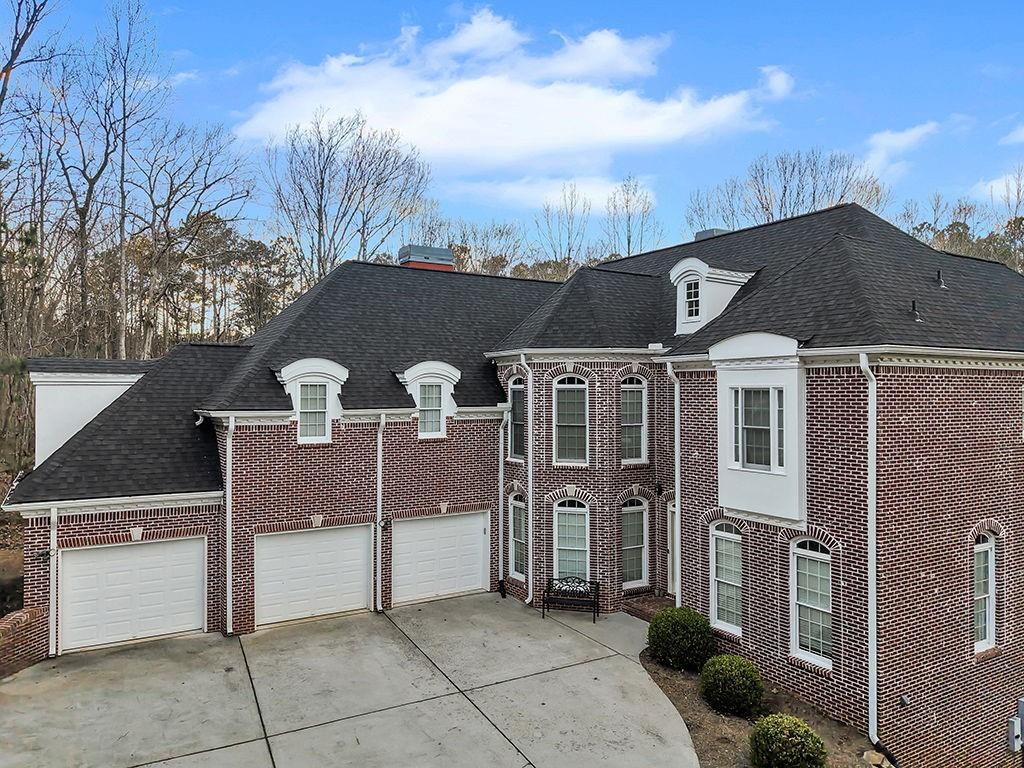 129 Preserve Parkway Ball Ground, GA 30107 - Photo 63 of 76 a front view of a house with parking space