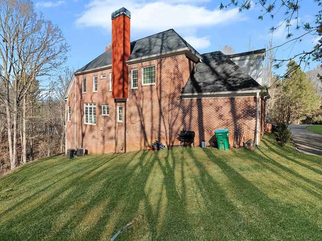 129 Preserve Parkway Ball Ground, GA 30107 - Photo 67 of 76 a front view of a house with a yard