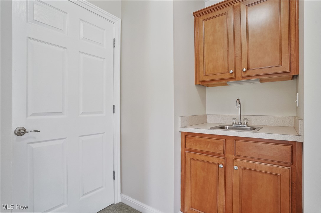7305 Alexander Road Painesville, OH 44077 - Photo 33 of 50 wet bar in primary bedroom