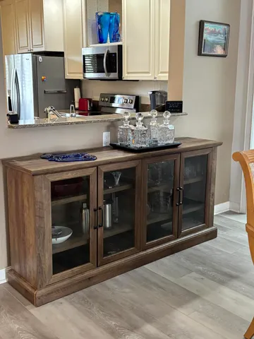 a kitchen with stainless steel appliances granite countertop a stove and a microwave