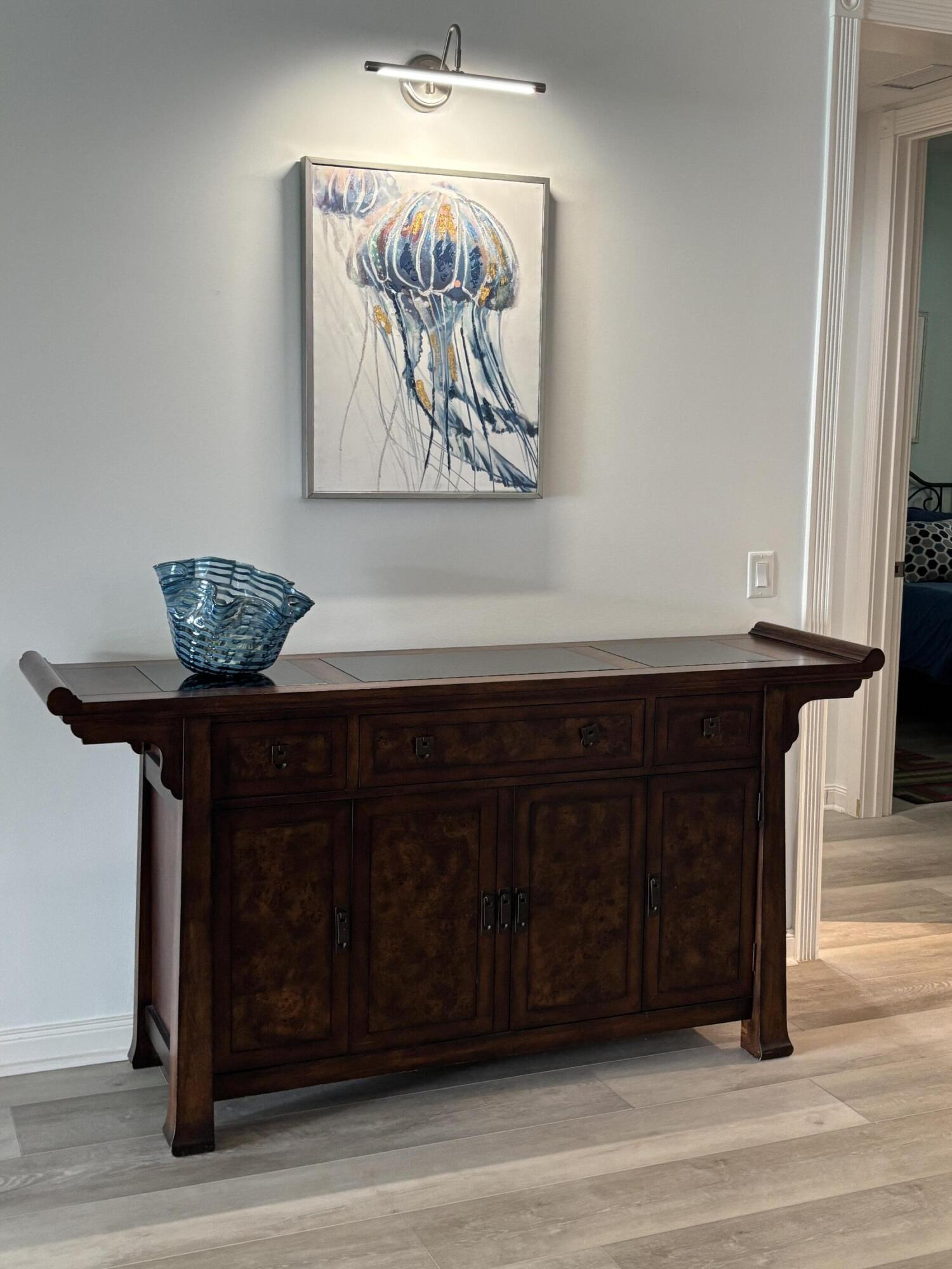 9 Harbour Isle Drive East, Unit 102 Fort Pierce, FL 34949 - Photo 12 of 30 a view of a wooden floor with a table