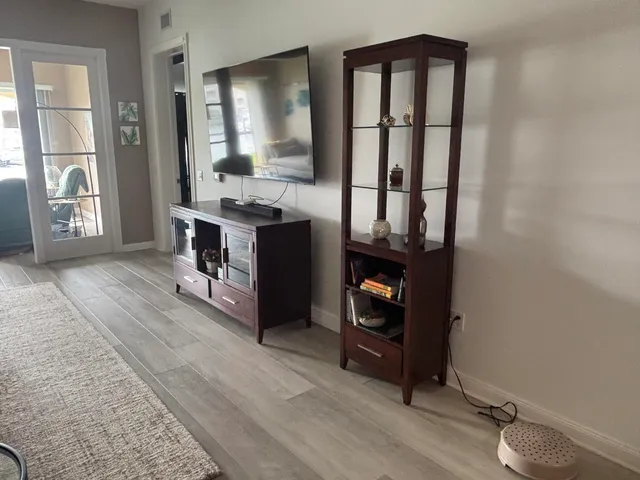 a view of living room with furniture and window