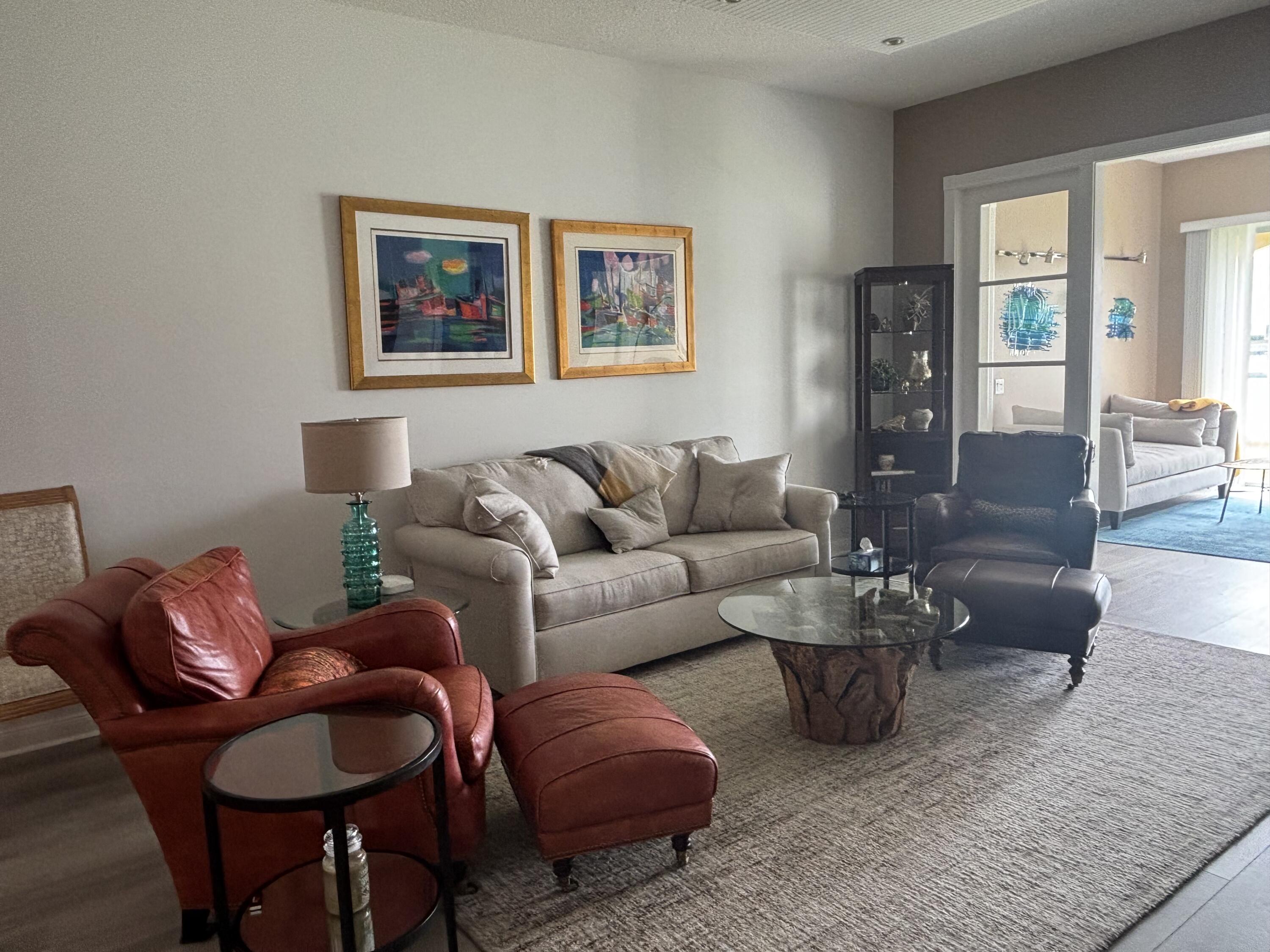 9 Harbour Isle Drive East, Unit 102 Fort Pierce, FL 34949 - Photo 15 of 30 a living room with furniture potted plant and kitchen view