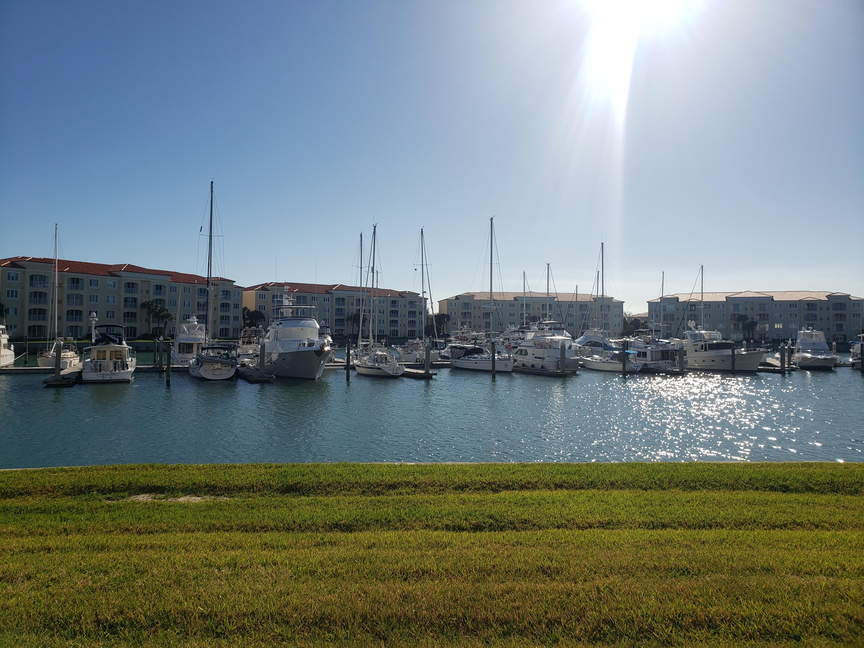9 Harbour Isle Drive East, Unit 102 Fort Pierce, FL 34949 - Photo 19 of 30 a view of a lake with a house