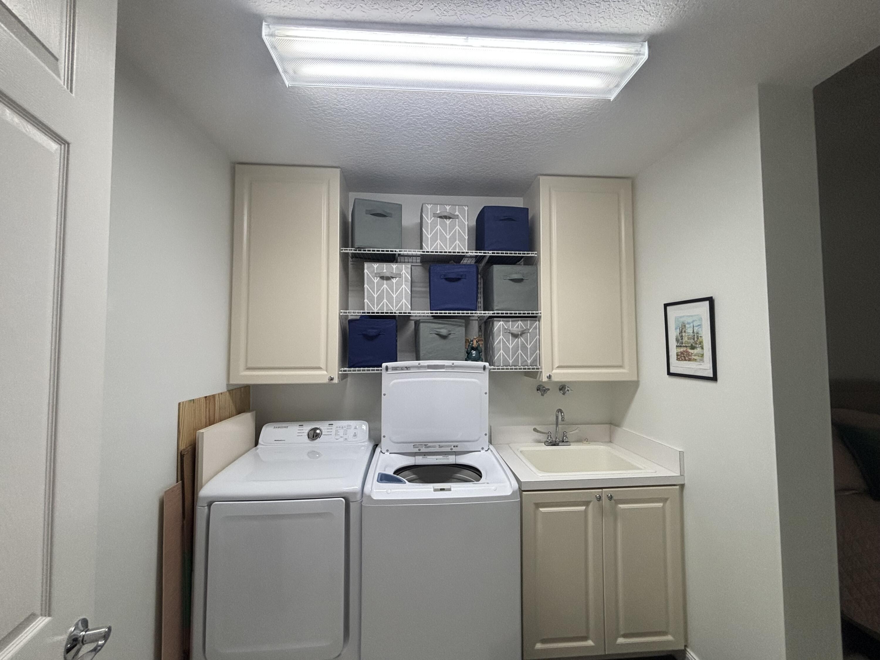 9 Harbour Isle Drive East, Unit 102 Fort Pierce, FL 34949 - Photo 28 of 30 a view of storage and utility room with washer and dryer
