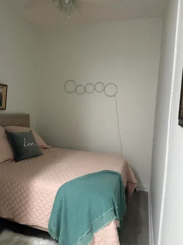 a bedroom with a bed and cabinets