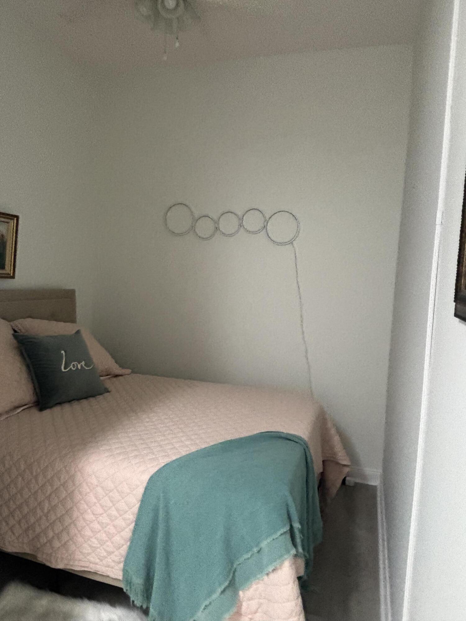 9 Harbour Isle Drive East, Unit 102 Fort Pierce, FL 34949 - Photo 29 of 30 a bedroom with a bed and cabinets