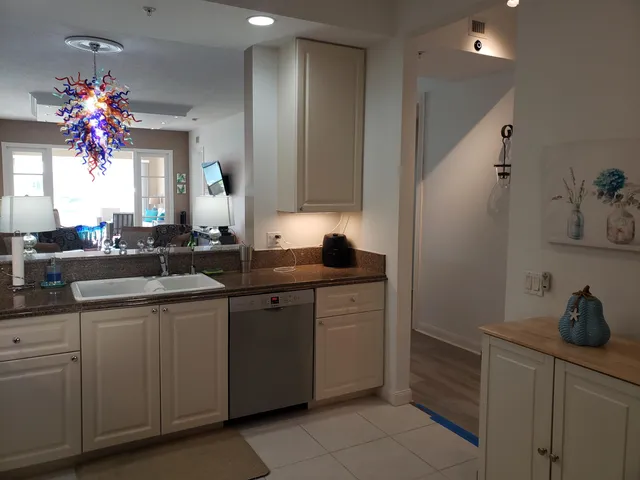 a kitchen with sink cabinets and window