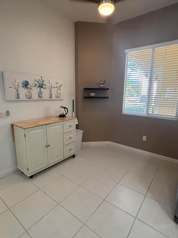 a room with a cabinet and a window