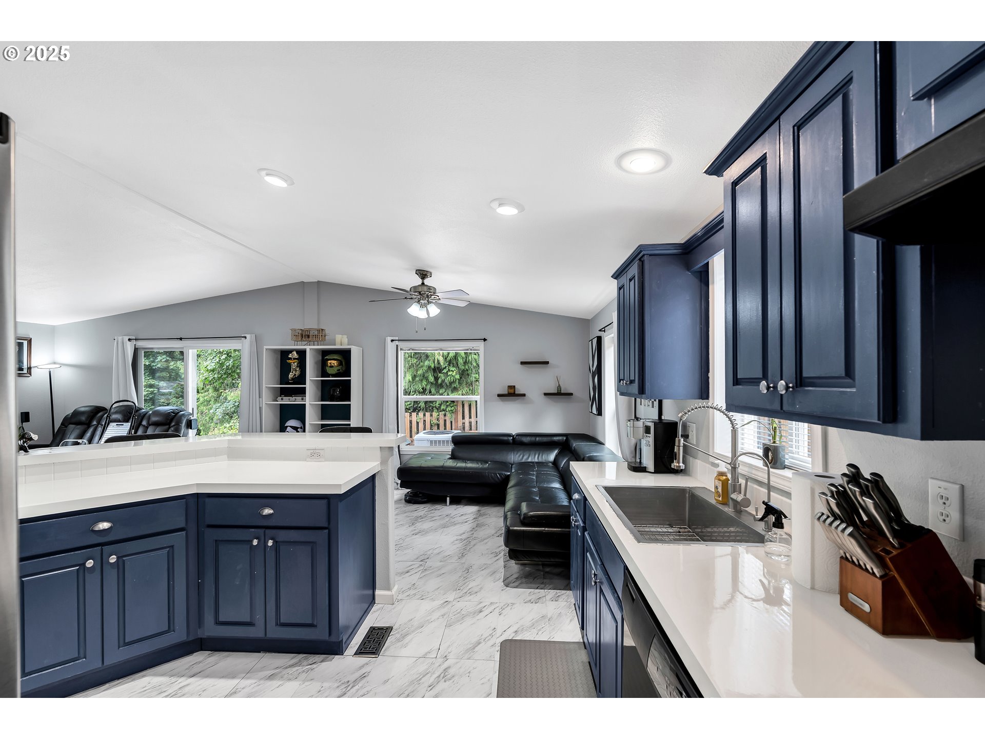 8750 Southeast 155th Avenue, Unit 28 Happy Valley, OR 97086 - Photo 11 of 28 a kitchen with granite countertop a sink stove and cabinets