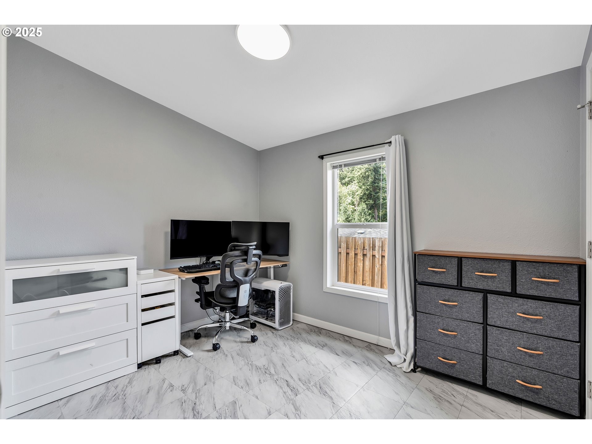 8750 Southeast 155th Avenue, Unit 28 Happy Valley, OR 97086 - Photo 15 of 28 a view of a workspace with furniture and a window