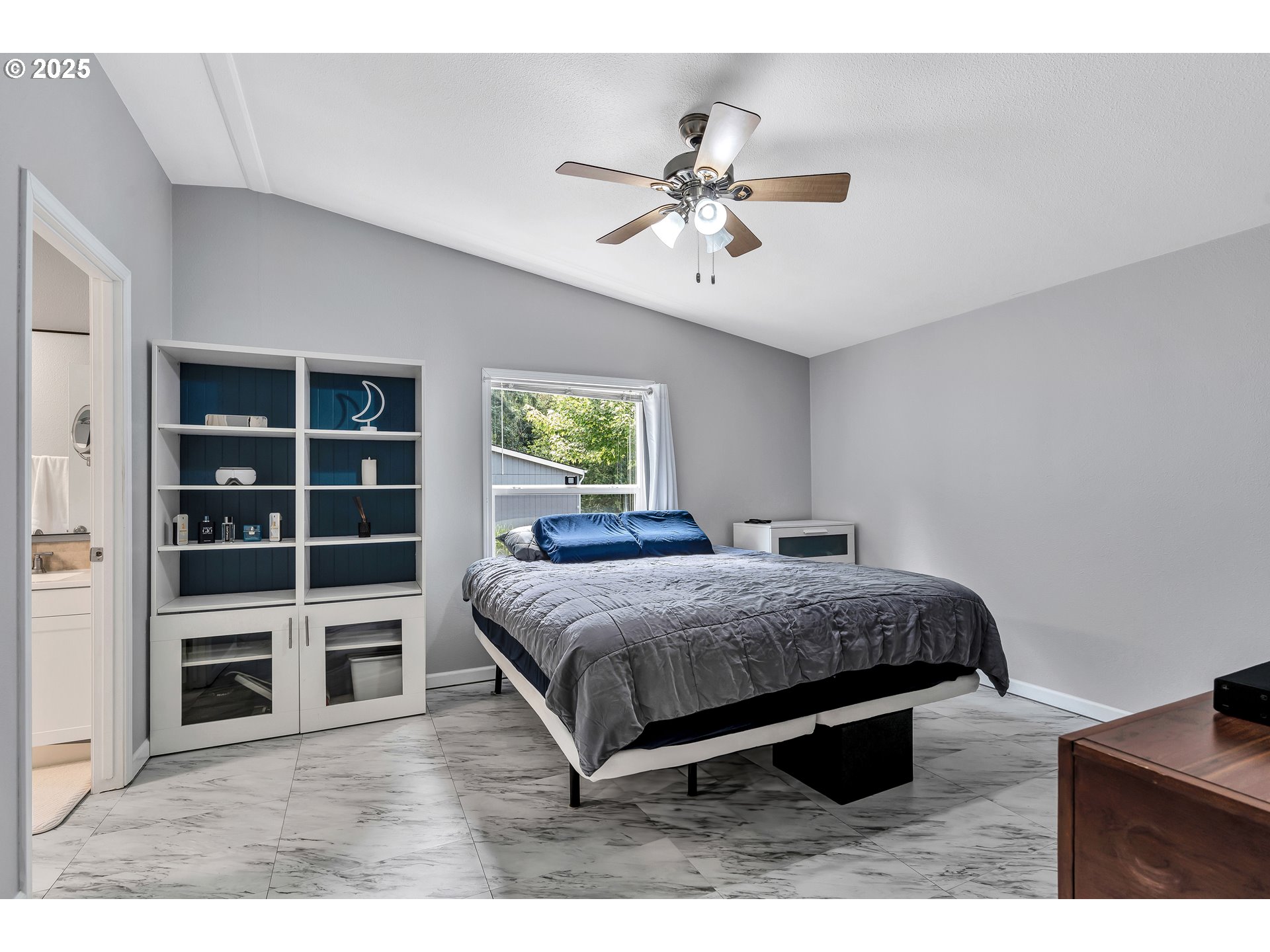 8750 Southeast 155th Avenue, Unit 28 Happy Valley, OR 97086 - Photo 17 of 28 a bedroom with a bed and a view of kitchen