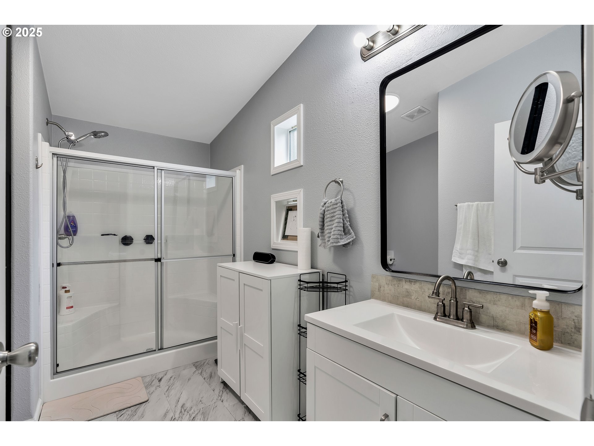 8750 Southeast 155th Avenue, Unit 28 Happy Valley, OR 97086 - Photo 21 of 28 a bathroom with a sink vanity and mirror
