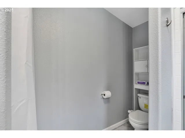 a bathroom with a toilet and a sink