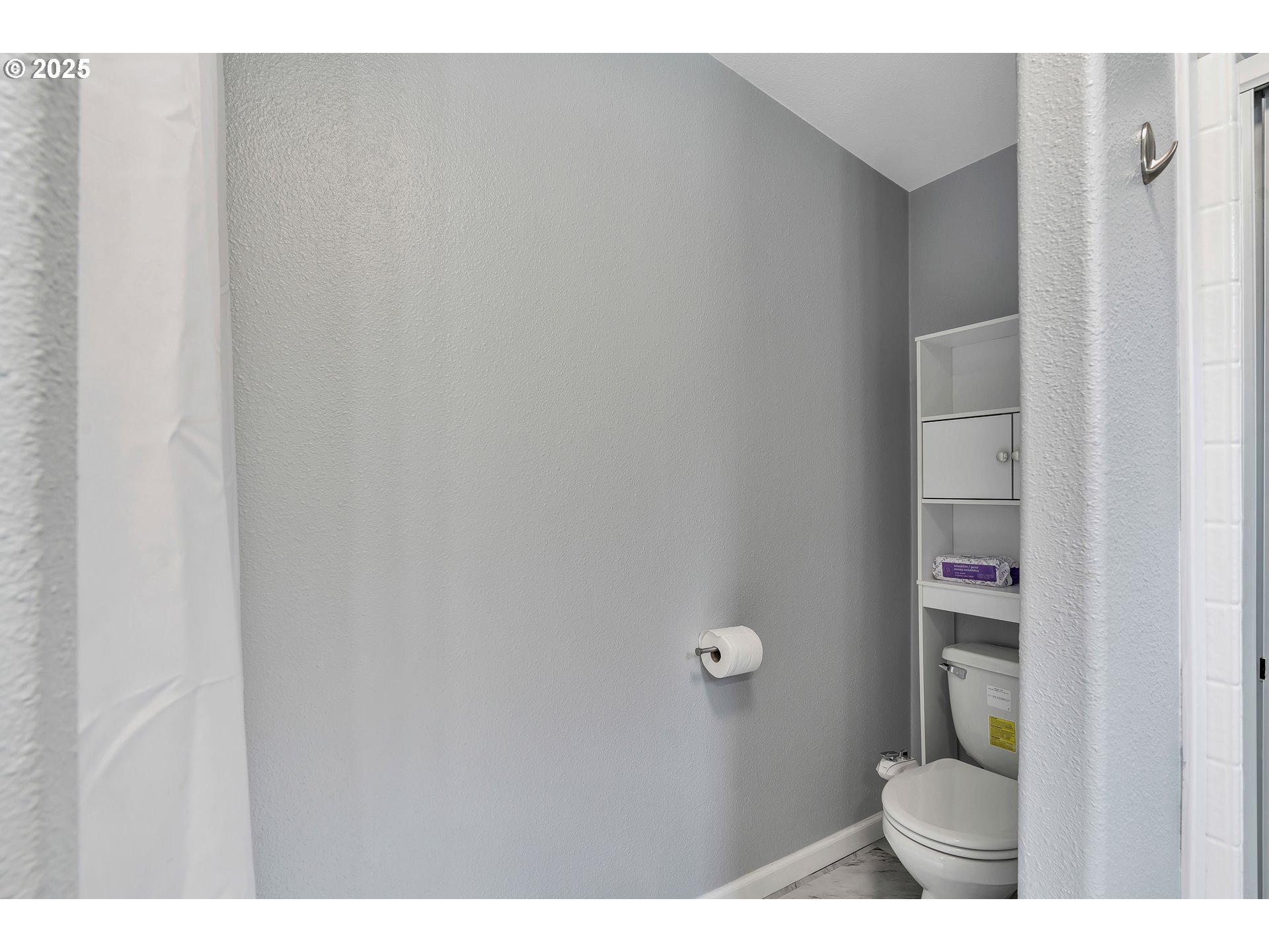 8750 Southeast 155th Avenue, Unit 28 Happy Valley, OR 97086 - Photo 22 of 28 a bathroom with a toilet and a sink