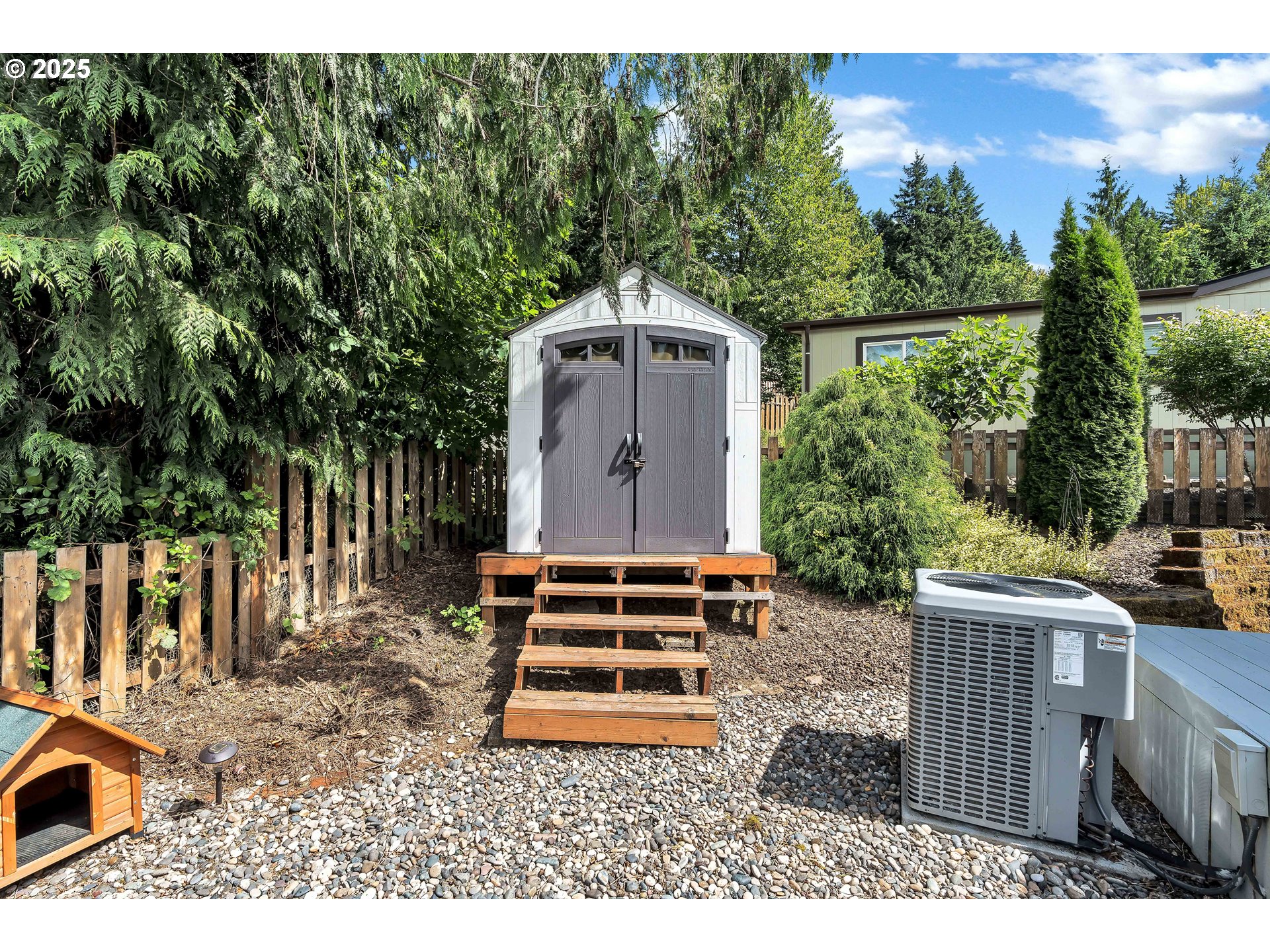 8750 Southeast 155th Avenue, Unit 28 Happy Valley, OR 97086 - Photo 25 of 28 a backyard of a house with lots of green space
