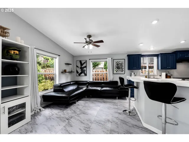 a living room with furniture and a window