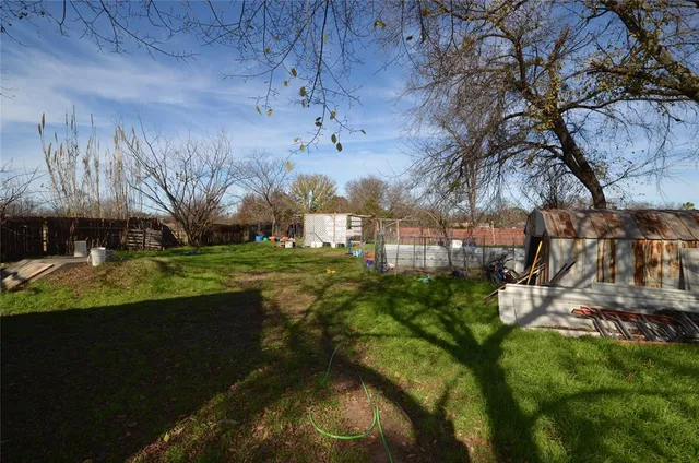 a view of backyard with green space