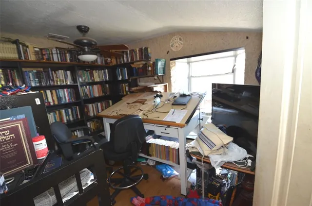 a bedroom with bed and window