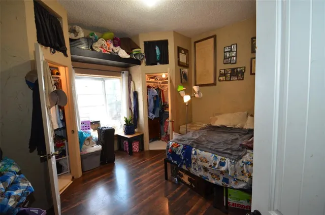 a view of a patio with table and chairs with wooden fence and plants