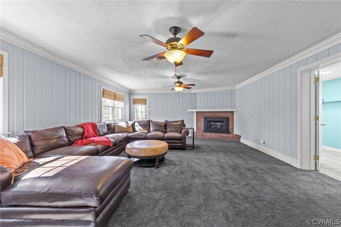 8822 Chippenham Road Richmond, VA 23235 - Photo 19 of 37 a living room with furniture a fireplace and a window