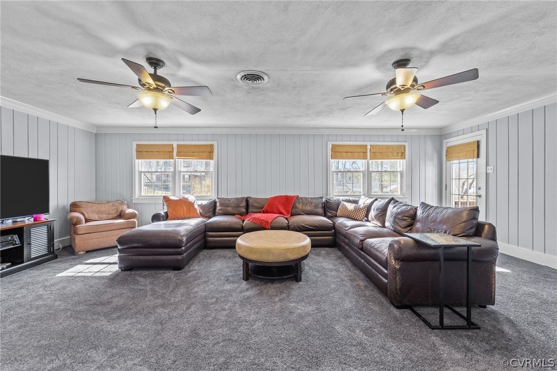 8822 Chippenham Road Richmond, VA 23235 - Photo 20 of 37 a living room with furniture a chandelier and a window