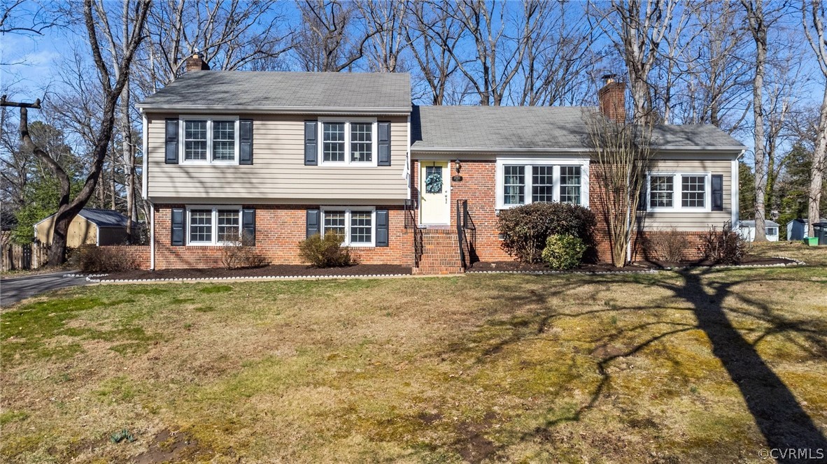 8822 Chippenham Road Richmond, VA 23235 - Photo 2 of 37 a front view of a house with a yard