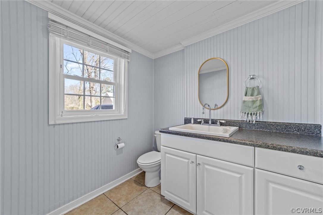 8822 Chippenham Road Richmond, VA 23235 - Photo 21 of 37 a bathroom with a toilet sink and mirror