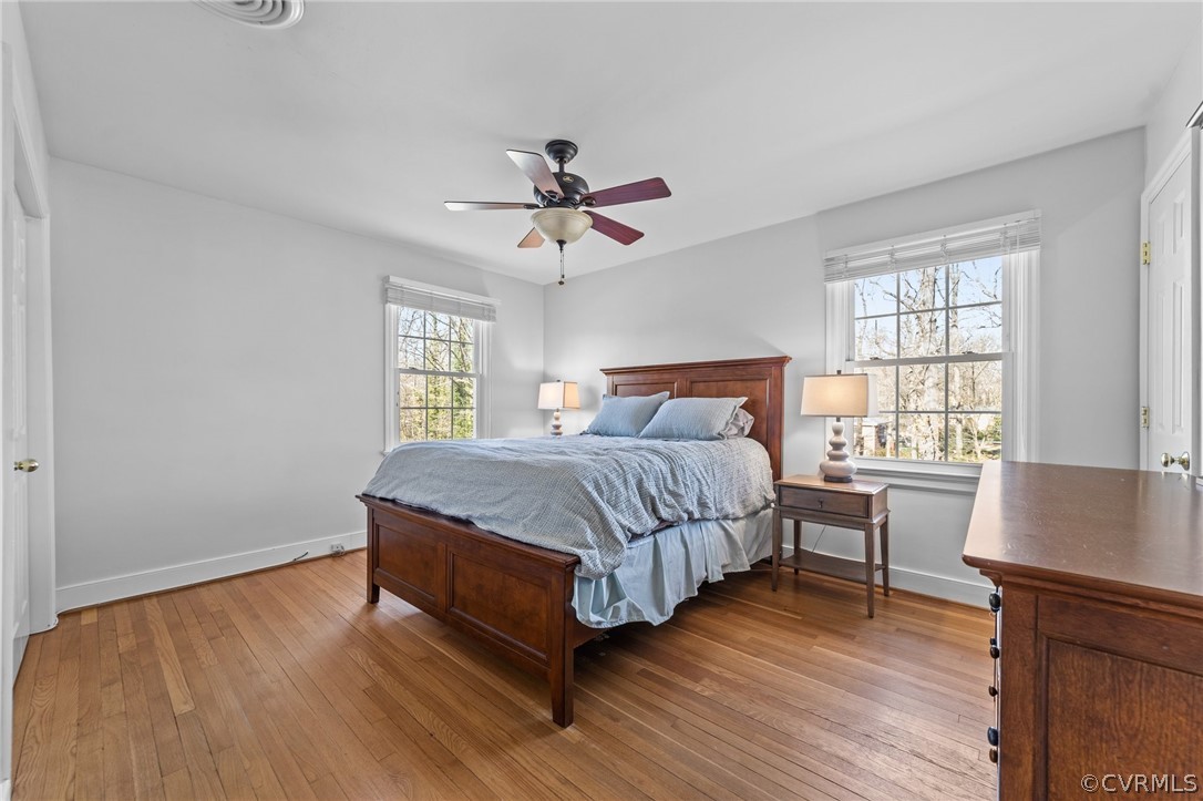 8822 Chippenham Road Richmond, VA 23235 - Photo 28 of 37 a bedroom with a bed and wooden floor