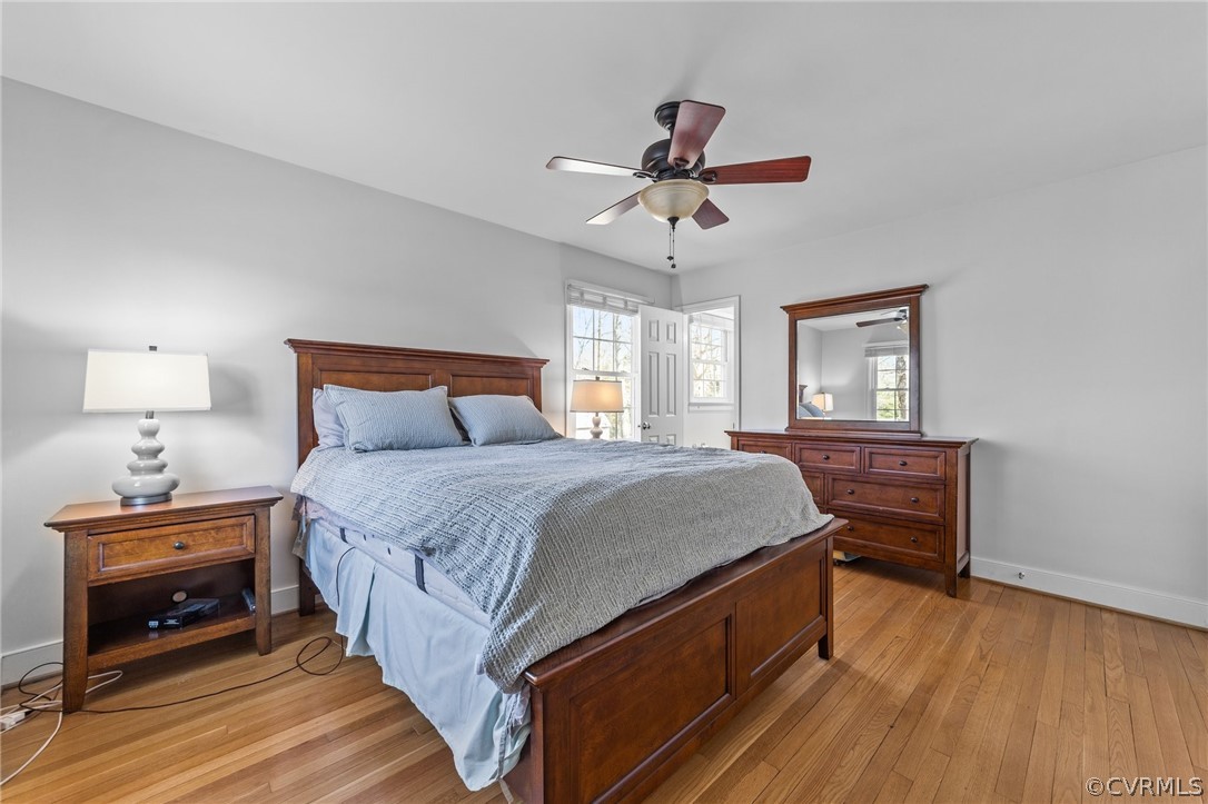 8822 Chippenham Road Richmond, VA 23235 - Photo 29 of 37 a bedroom with a bed and wooden floor